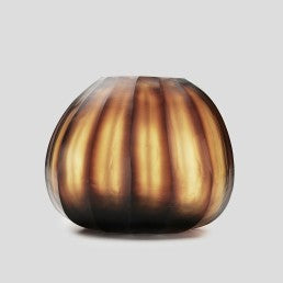The Aura vase is mouth blown molten glass which is then hand carved to produce linear cuts making each piece totally unique.
