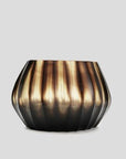 The Aura vase is mouth blown molten glass which is then hand carved to produce linear cuts making each piece totally unique.
