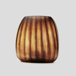 The Aura vase is mouth blown molten glass which is then hand carved to produce linear cuts making each piece totally unique.