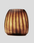 The Aura vase is mouth blown molten glass which is then hand carved to produce linear cuts making each piece totally unique.