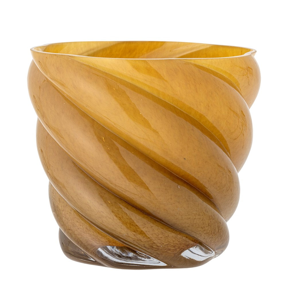 The Callo Flowerpot is mouth-blown and with an elegant swirl effect, brings a ray of sunshine into your home with its golden glaze. Its curved shape and wavy edges offer dynamics and character, as well as an ideal place for your herbs or small plants.