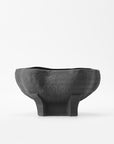 The Conch bowl is the perfect accent piece that showcases a refined organic form. Black and textured surace.
