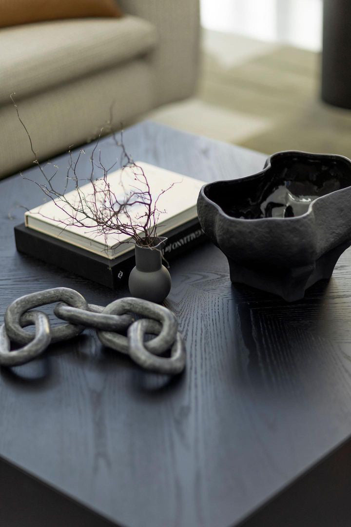 The Conch bowl is the perfect accent piece that showcases a refined organic form. Black and textured surface.