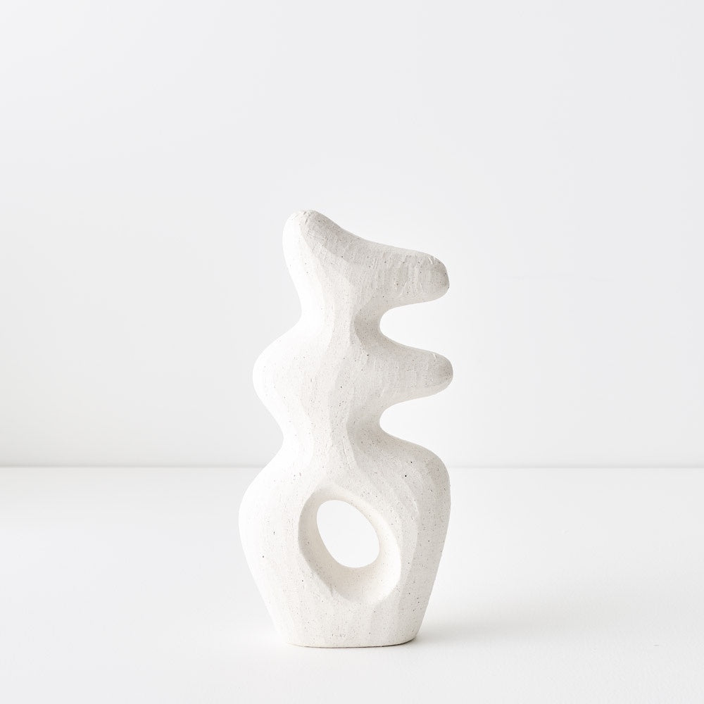This decorative object is versatile enough to nest with other items or stand alone as a striking centrepiece. Its sleek metallic finish adds a touch of elegance and sophistication to any space. It has a white chalk like finish.