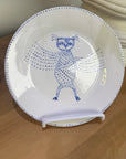 ceramic wall plate featuring blue cosmic owl by artist Nadia Robertson