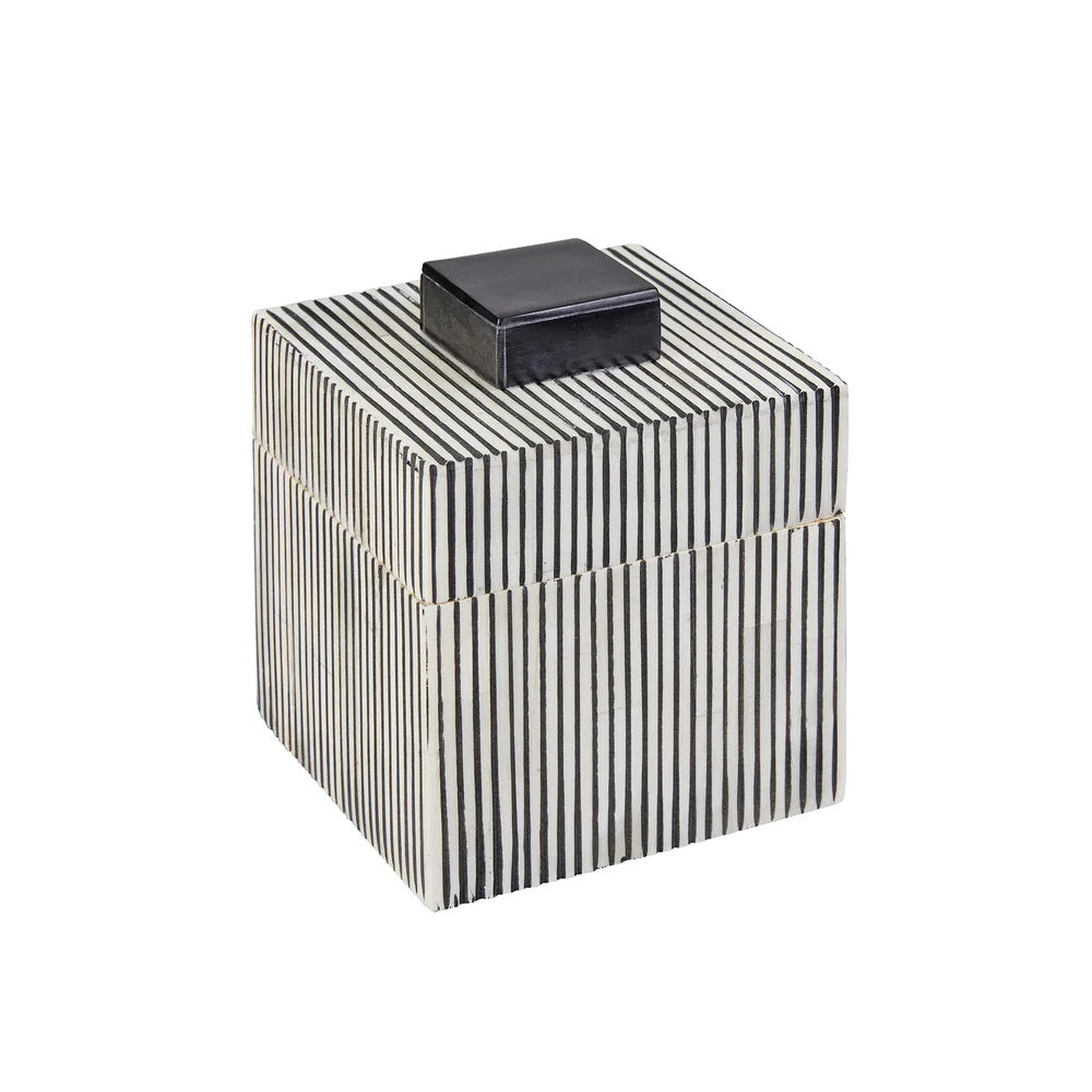 Black and white striped box with a black lid