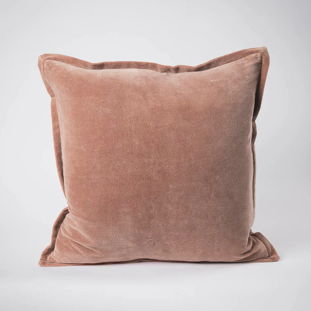 Meticulously crafted from the finest 100% short pile glossy cotton velvet and dyed to achieve a rich palette of exquisite hues with luxurious sheen. Each cushion is thoughtfully reimagined with a 1cm flange, offering a functional yet sophisticated option. Colour Clay. 50cm square
