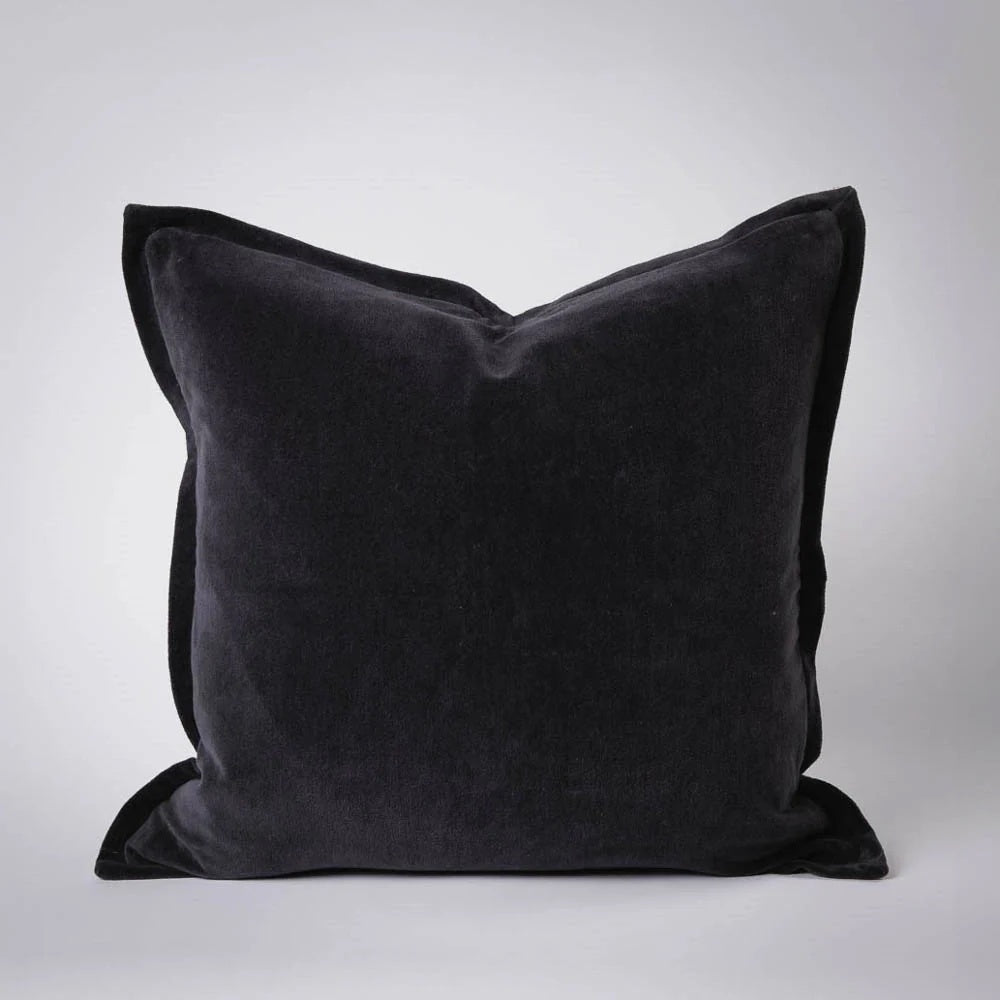 Meticulously crafted from the finest 100% short pile glossy cotton velvet and dyed to achieve a rich palette of exquisite hues with luxurious sheen. Each cushion is thoughtfully reimagined with a 1cm flange, offering a functional yet sophisticated option. Colour midnight. 50cm square