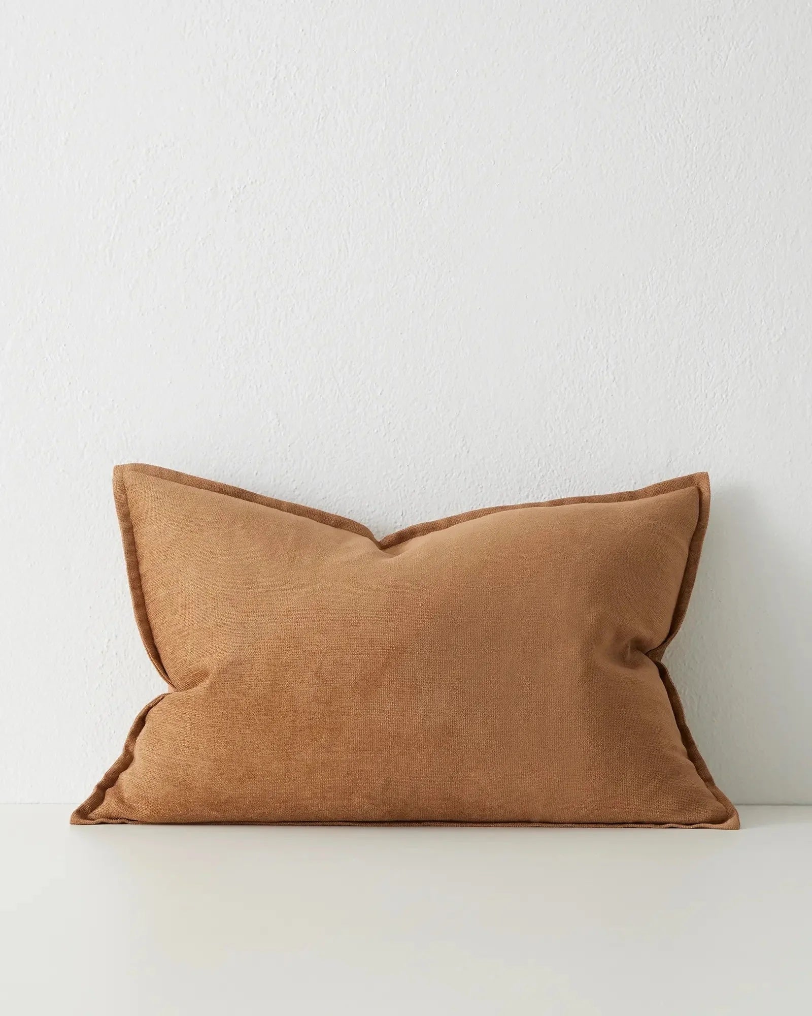 ochre cushion made from soft chenille fabric