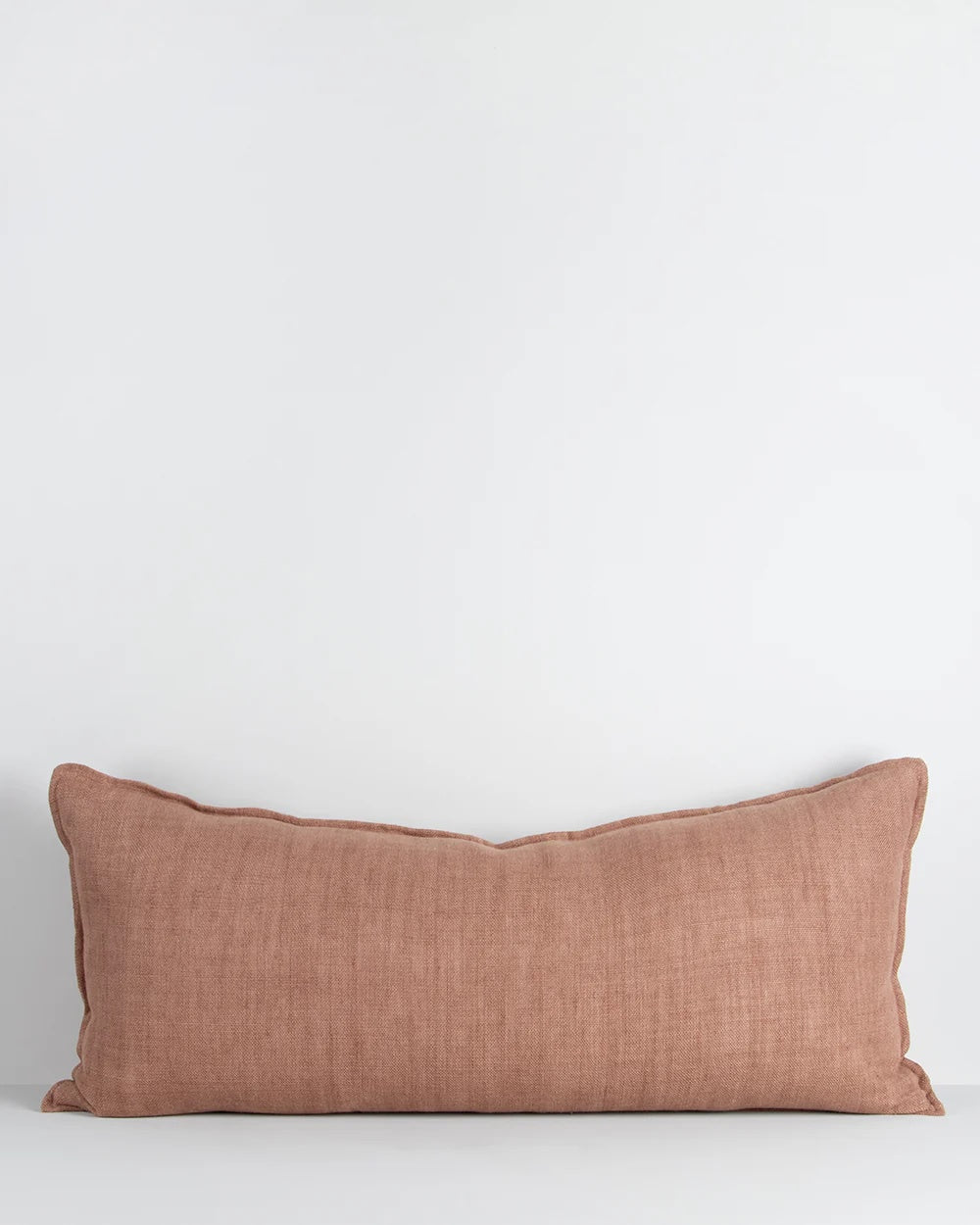 rich texture and pink clay tone of the Flaxmill long lumbar cushion. Handwoven from heavy-weight linen fibres, the long, lumbar shape is the perfect finishing touch for bedroom and living spaces.