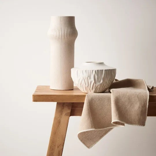 Gili is an ivory-coloured tall linear vase exudes understated elegance and modern simplicity. Its clean lines and neutral hue make it a versatile accent piece