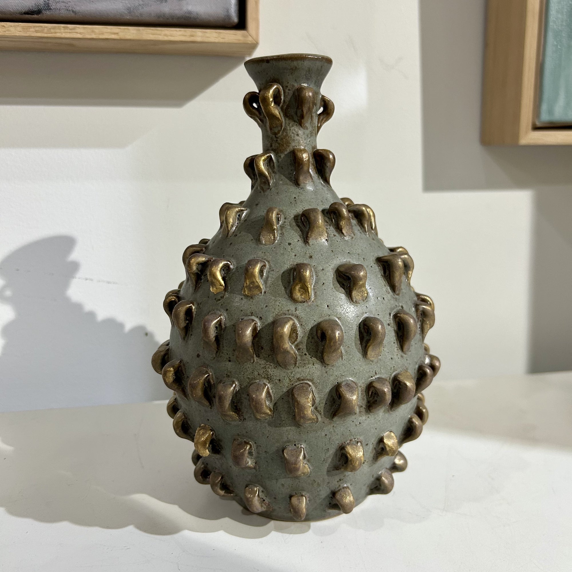 ceramic vase by artist Juyeon Kim. Created in the signature embroider series style. Matt blue detail with textured points.