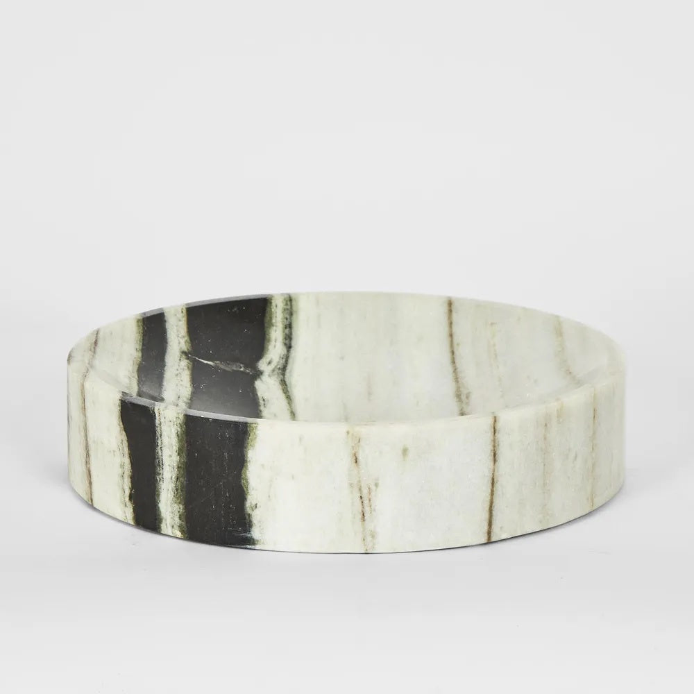Crafted from luxurious marble with captivating variations in color and veining, our Small Solange Marble Bowl in Black and White exudes unique sophistication.