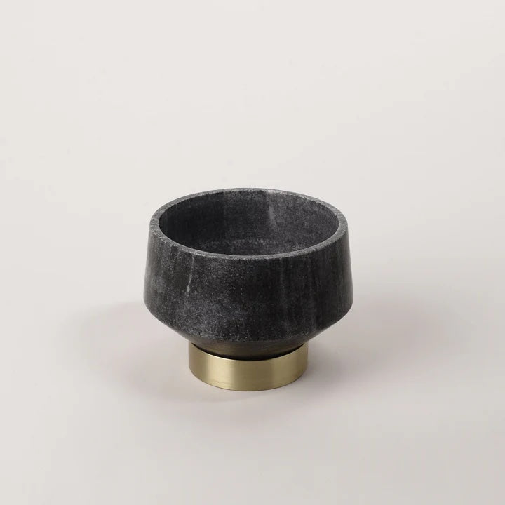 Beauty meets craftsmanship in this grey marble decorative bowl featuring a brass footed base.  Small size