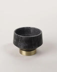 Beauty meets craftsmanship in this grey marble decorative bowl featuring a brass footed base. Small size