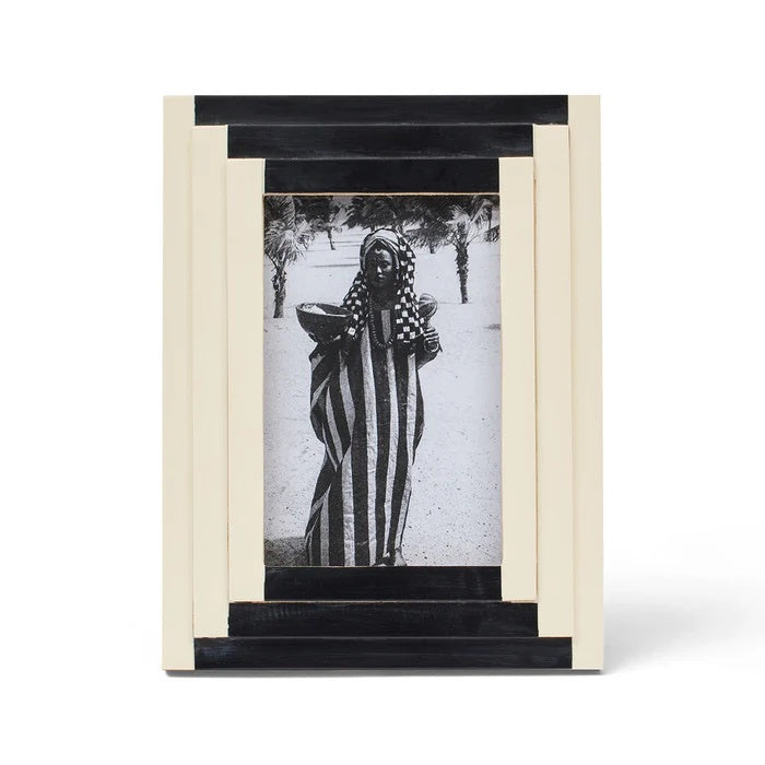 Milli Photo Frame in black & cream resin with deco style bevelled step design. Fits image size 4x6". This piece is expertly hand crafted and each will have its own unique characteristic.