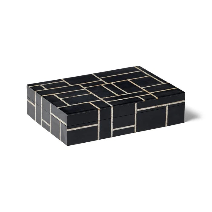 The Omari Box Rectangle. This striking design is handcrafted from black resin with a natural etched horn inlay in a grid pattern. It effortlessly & neatly stows your precious & small items while lending a sophisticated, cultured look.