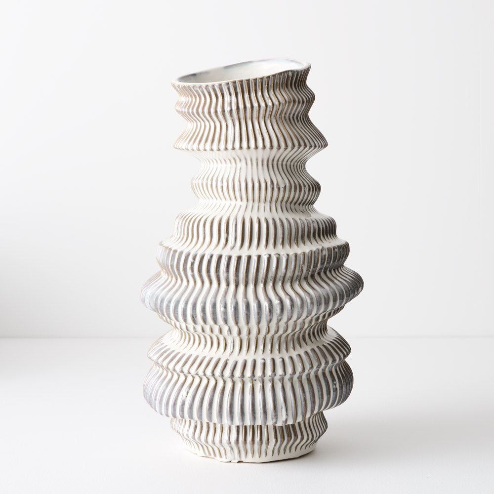 Handmade and glazed, it features unique details that make it a special and eye-catching decorative piece. textural and sculptural piece.