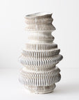 Handmade and glazed, it features unique details that make it a special and eye-catching decorative piece. textural and sculptural piece.