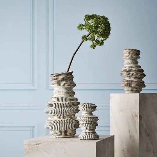 Handmade and glazed, it features unique details that make it a special and eye-catching decorative piece.