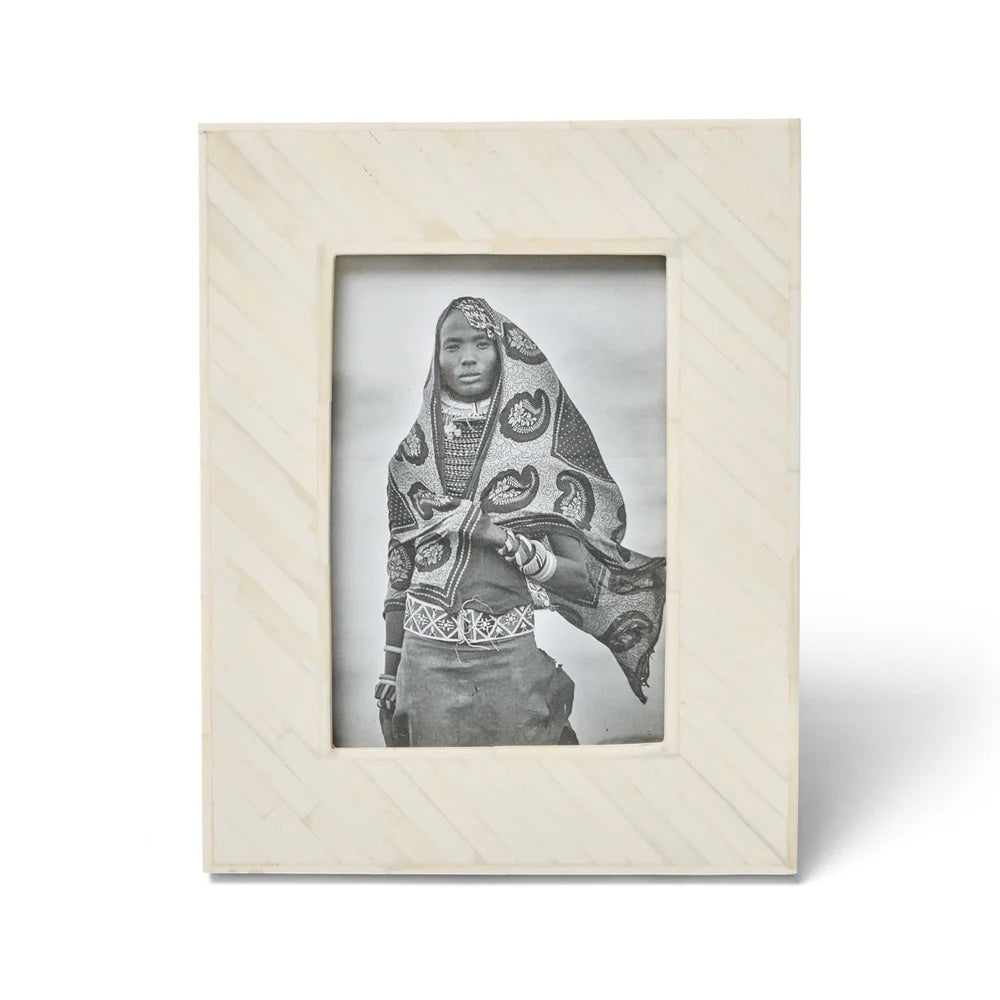 The Osage Photo Frame 5x7. This striking design is handcrafted from bone inlaid in a diagonal pattern.