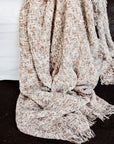 The Ritchi Throw combines three harmonious yarn colours—soft clay, midnight, and off-white—woven into a richly textured slub weave. very textural.