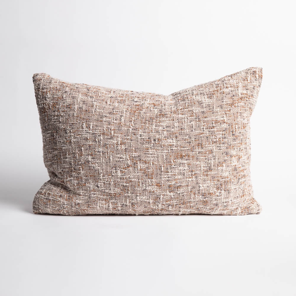 The Ritchi Cushion combines three harmonious yarn colours—soft clay, midnight, and off-white—woven into a richly textured slub weave. Very textural. 40x60cm