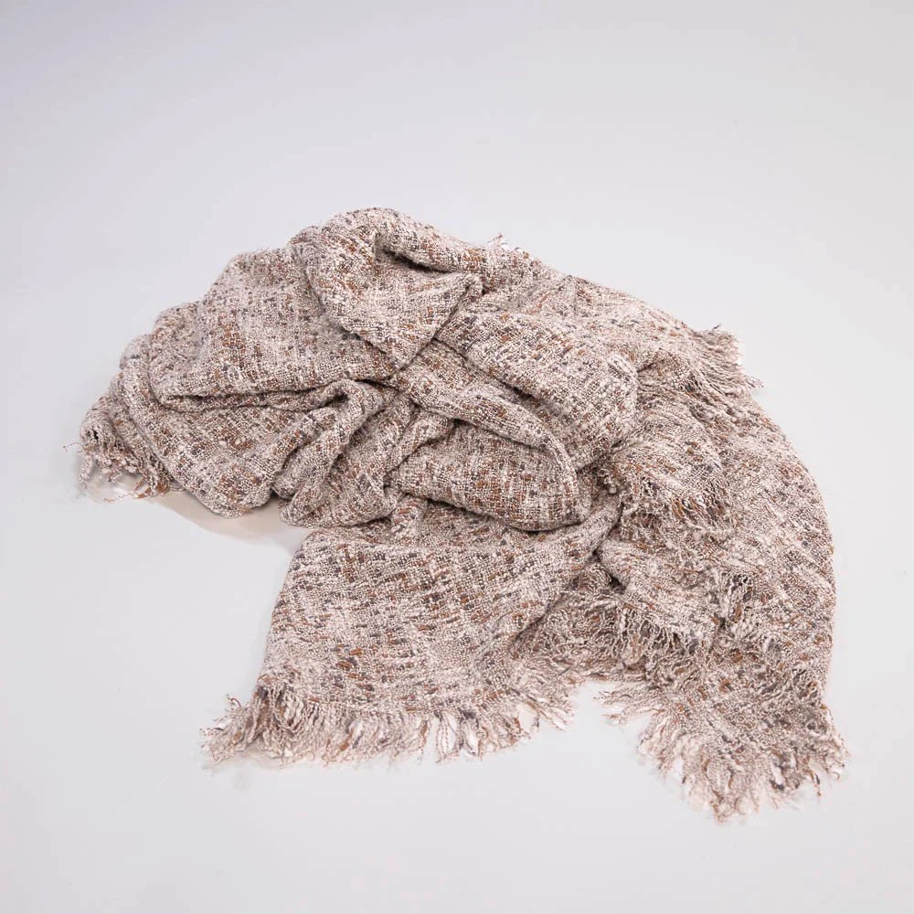 The Ritchi Throw combines three harmonious yarn colours—soft clay, midnight, and off-white—woven into a richly textured slub weave. very textural.