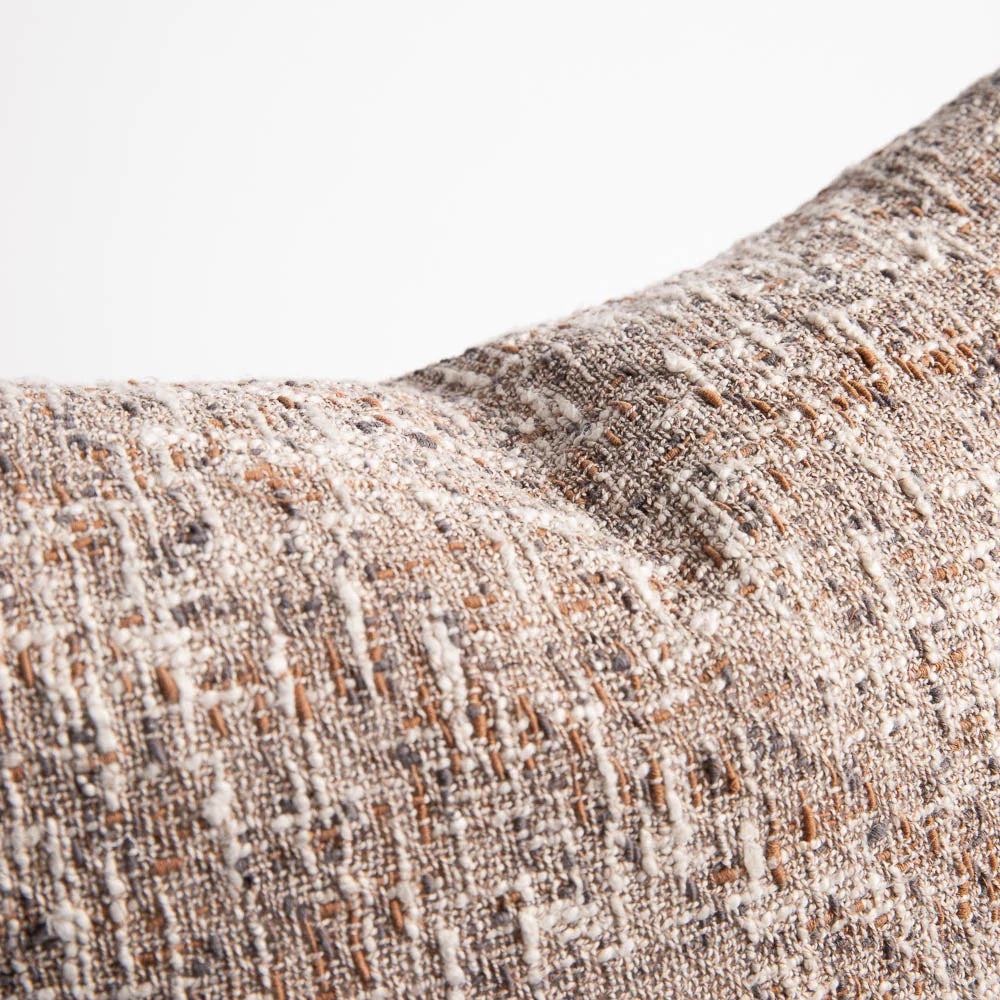 The Ritchi Cushion combines three harmonious yarn colours—soft clay, midnight, and off-white—woven into a richly textured slub weave.