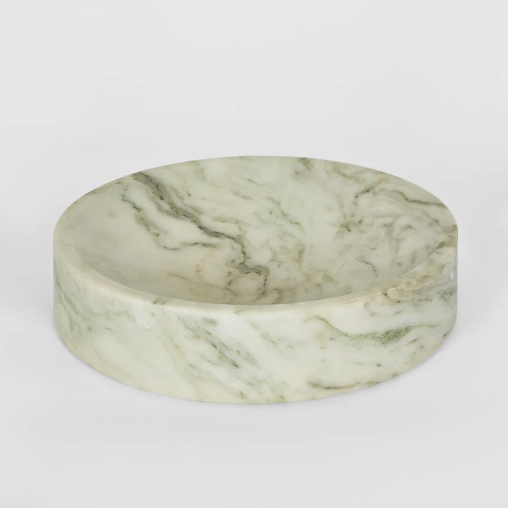 Crafted from luxurious marble with captivating variations in color and veining, our Small Solange Marble Bowl in Green and White exudes unique sophistication.