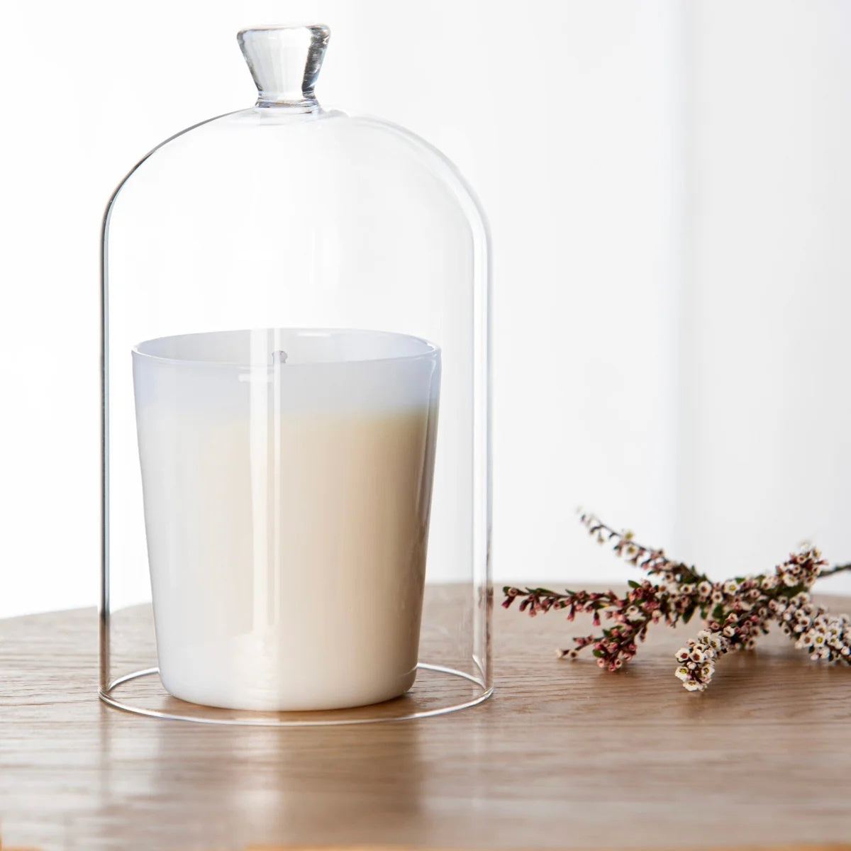 A glass candle cloche is the ultimate accessory for elevating your space. Not only does it keep your candles dust-free and extend their fragrance life, but it also adds a touch of elegance to your décor.