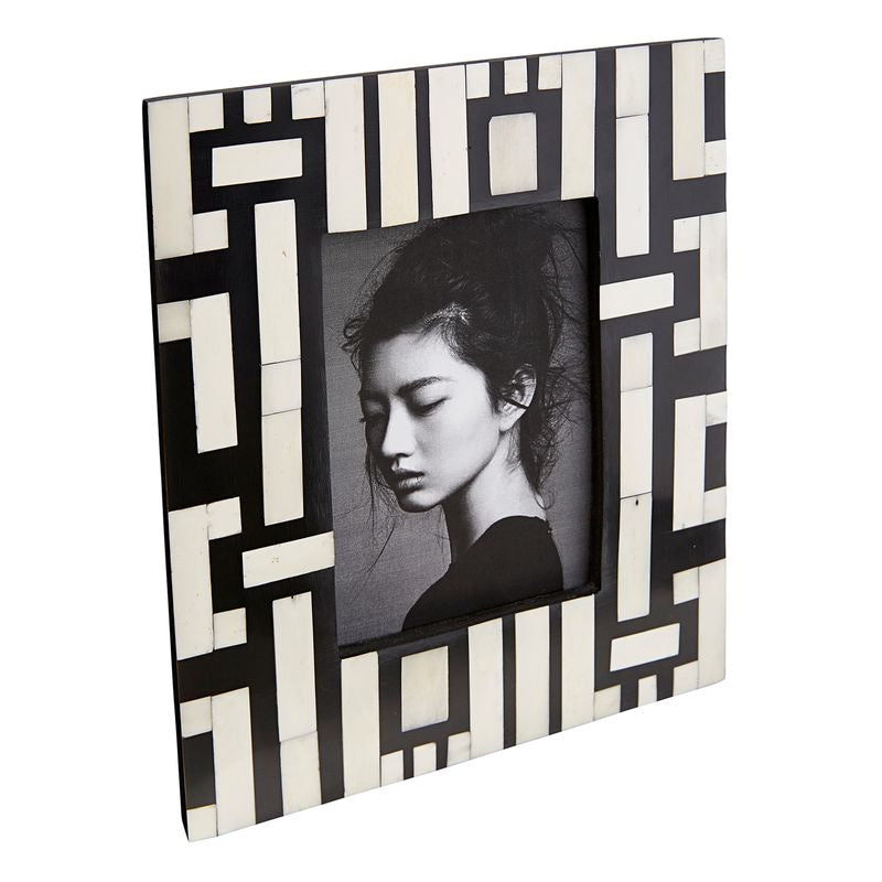 Geometric black and white photo frame with a portrait inside
