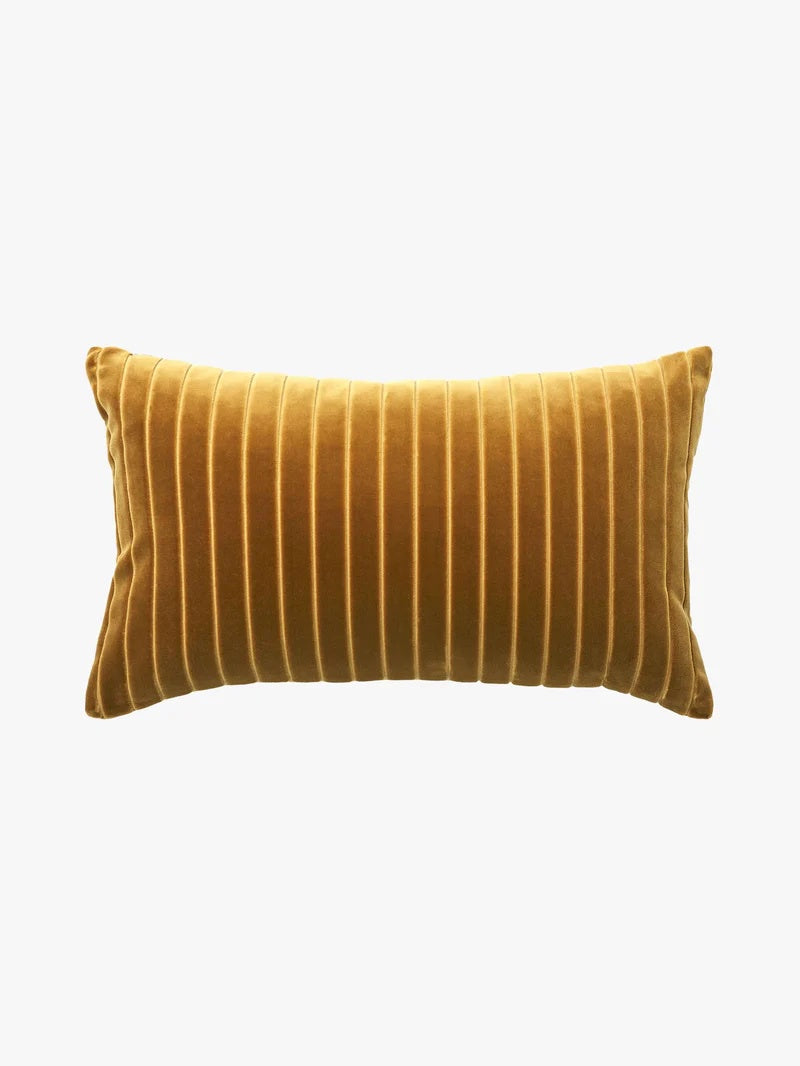 Mustard yellow striped pillow on a white background