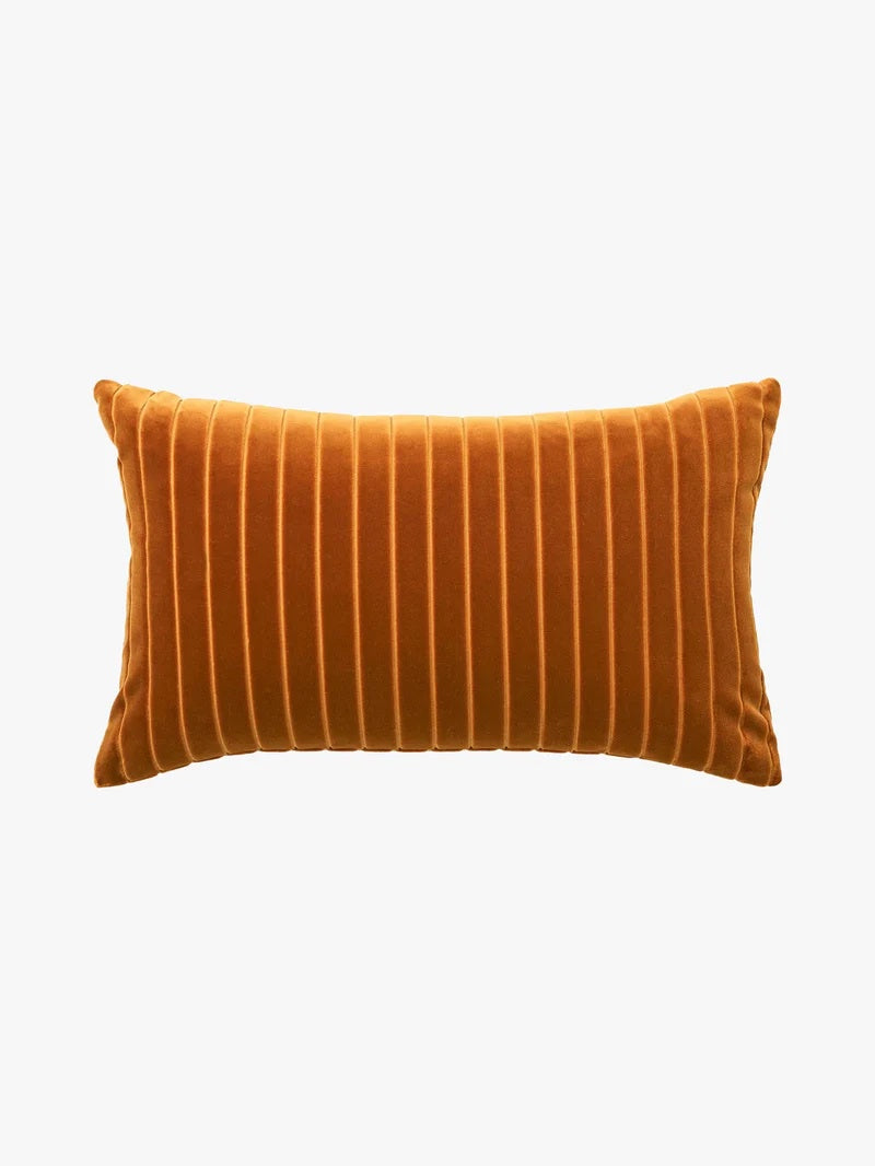 Orange striped pillow on a white background