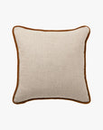 Beige pillow with toffee trim  edge detail.