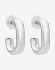 Pair of silver hoop earrings on a white background