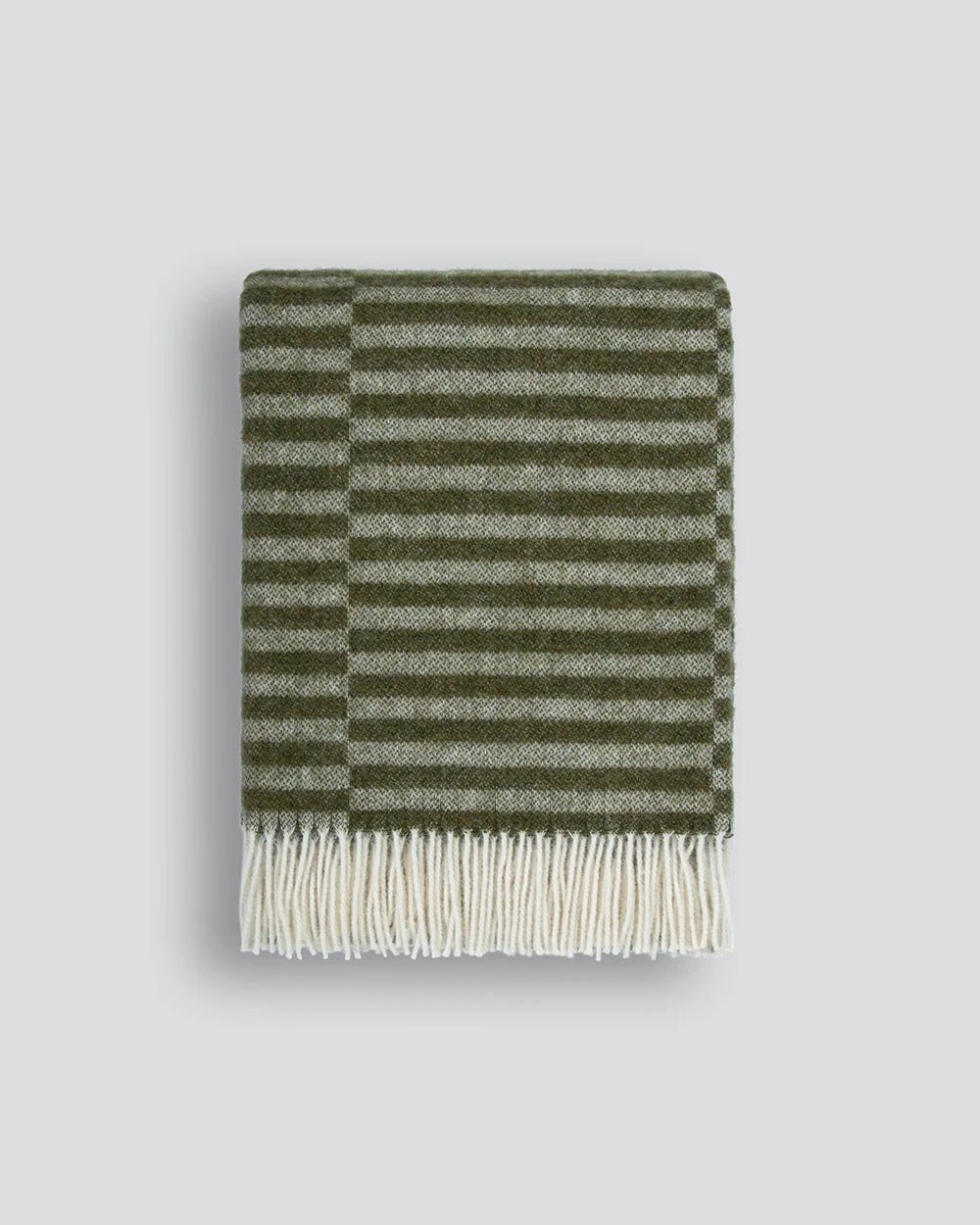 olive green striped blanket with white fringe