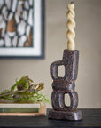 Decorative candle holder made from cast iron.