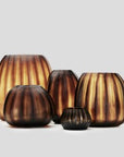 The Aura vase is mouth blown molten glass which is then hand carved to produce linear cuts making each piece totally unique.