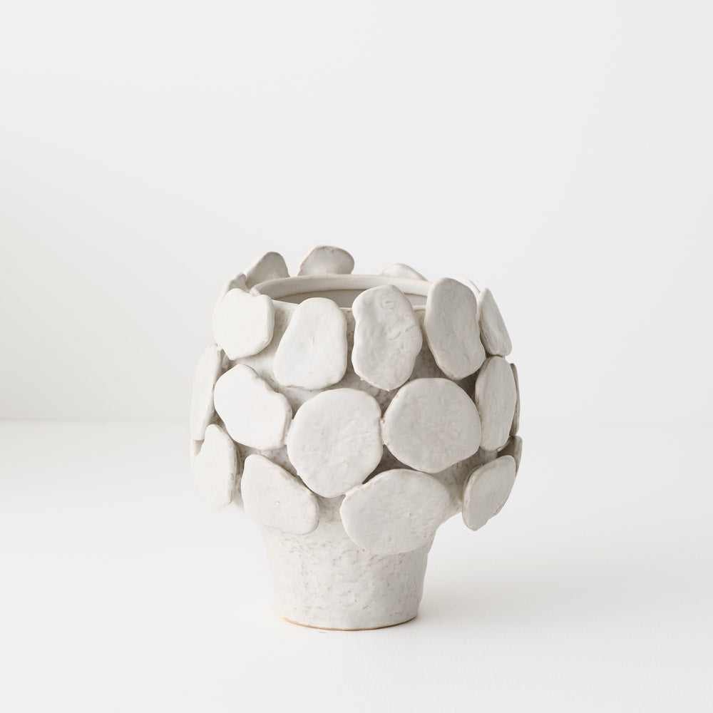 White ceramic vase with a unique sculptural design 