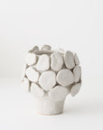 White ceramic vase with a unique sculptural design 