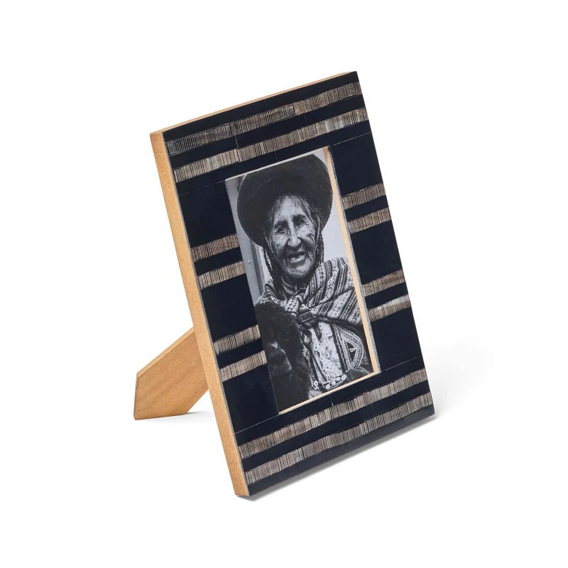 Striped photo frame with a black and white portrait made  from bone inlay