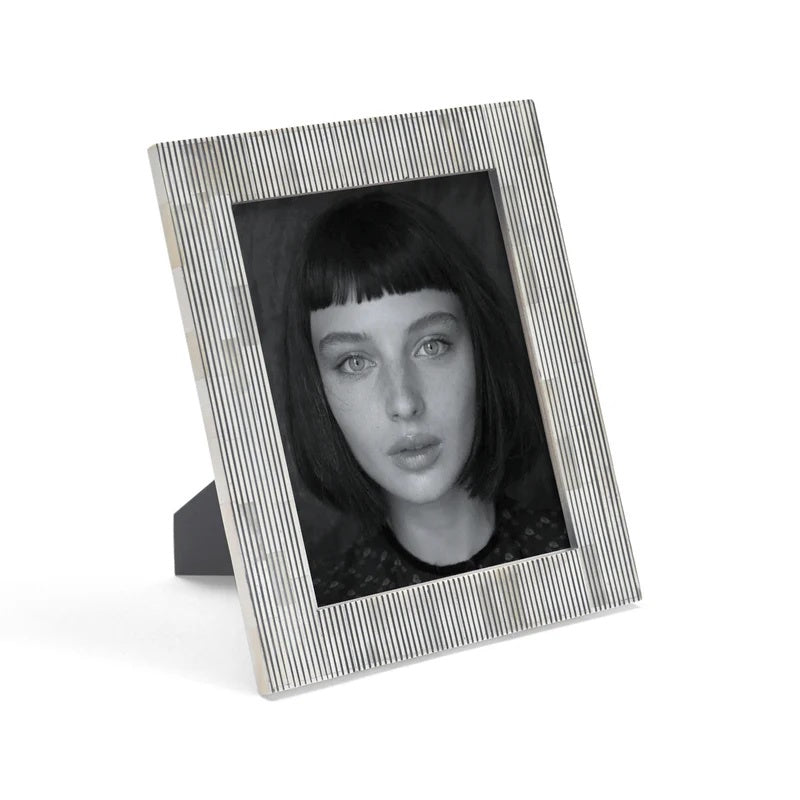 pinstripe photo frame with a black and white portrait of a woman on a white background