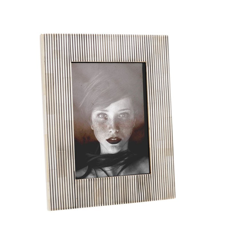 Decorative photo frame with a striped pattern on a white background