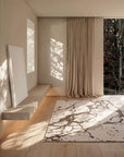 the Cameo Rug features an organic composition of flowing lines and tonal hues