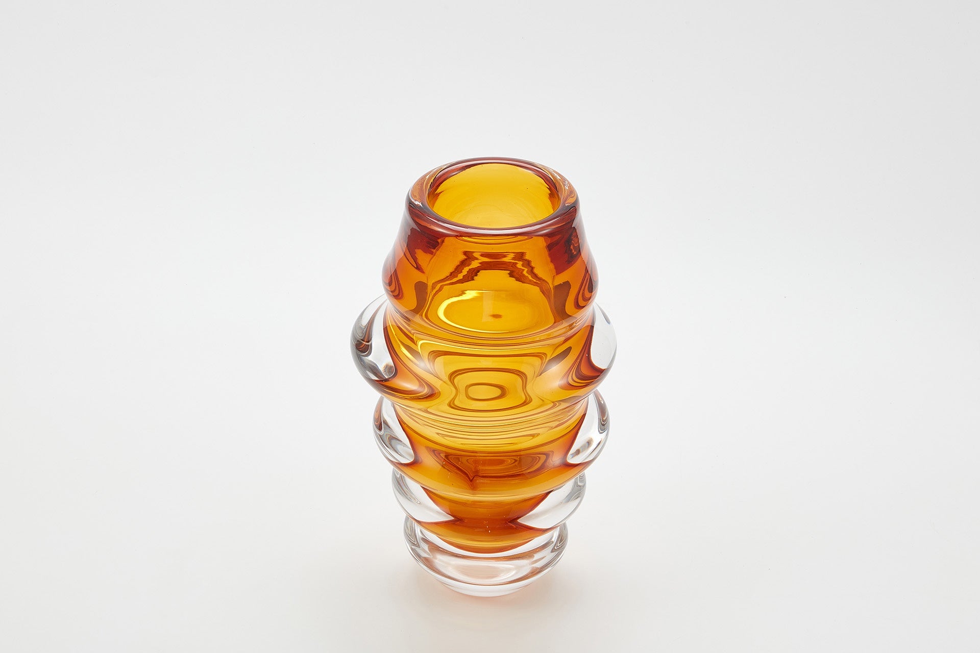 Amber glass vase with ribbed design 