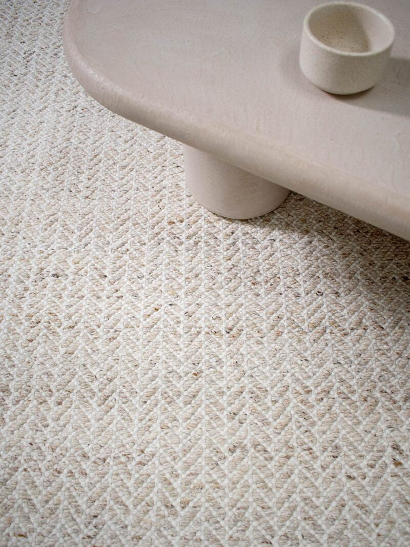 Close-up of a textured beige rug 