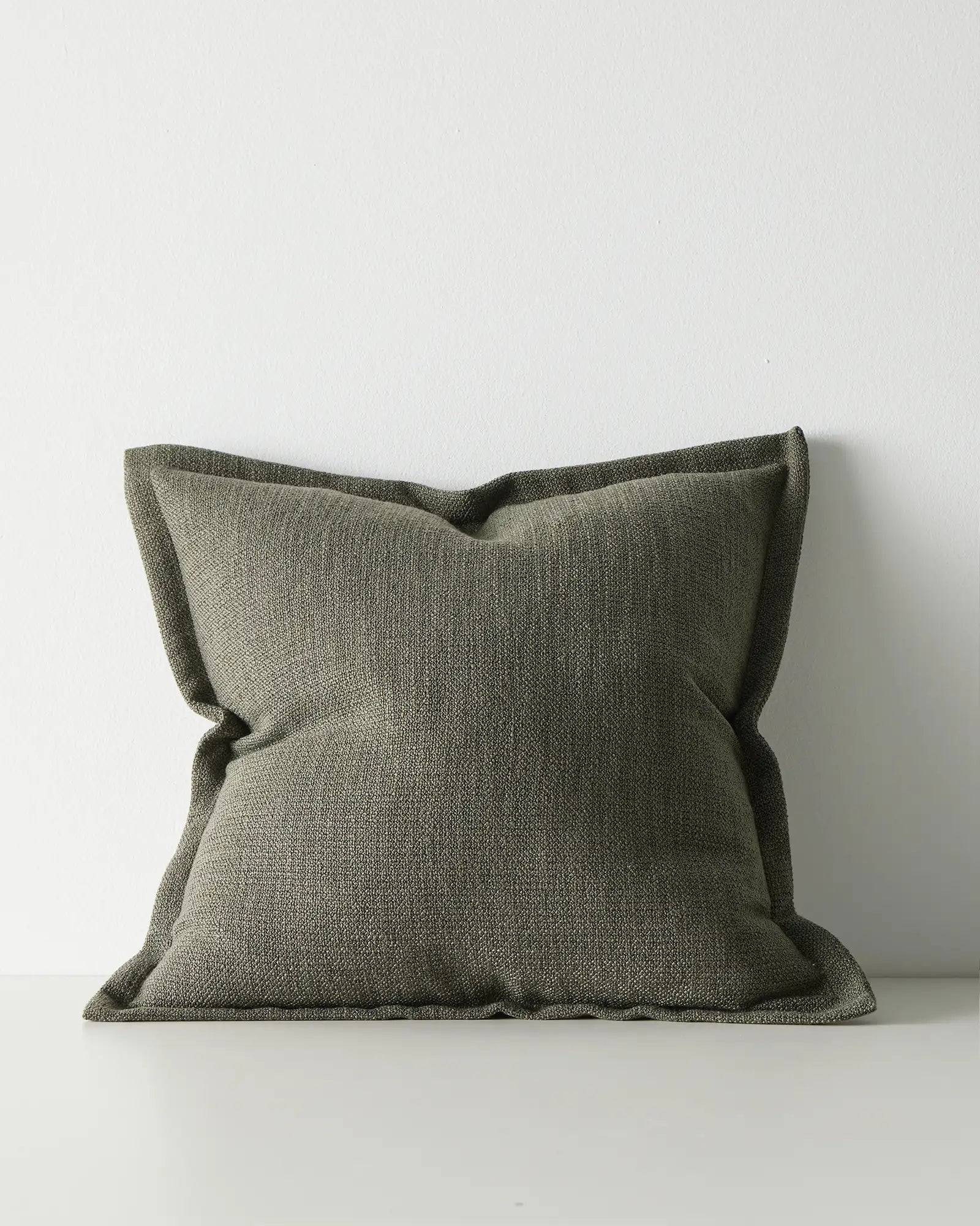 Green textured pillow with a flange edge