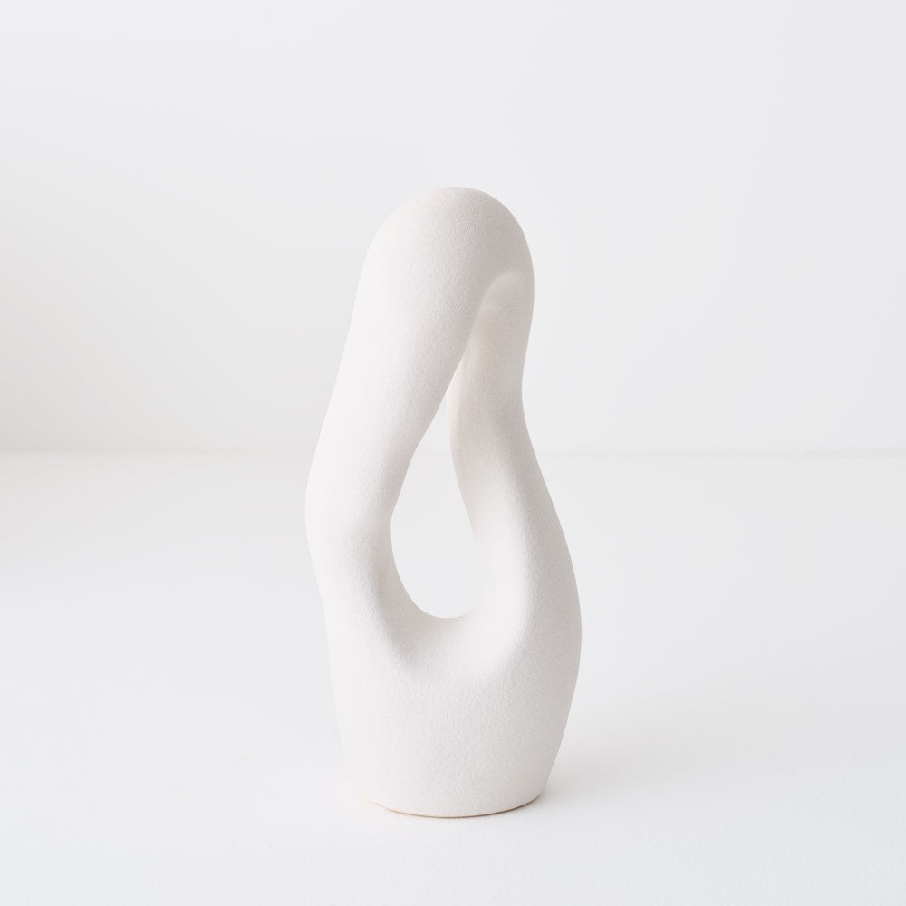 White ceramic vase with a wavy design 