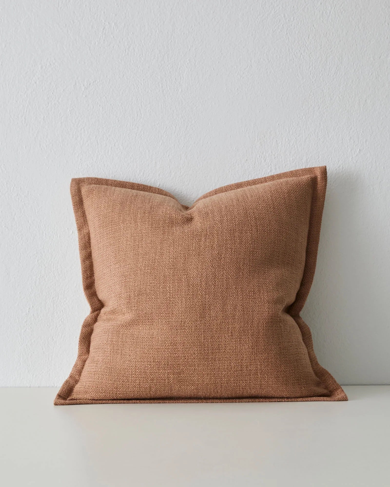 clay textured cushion  with a flanged edge detail
